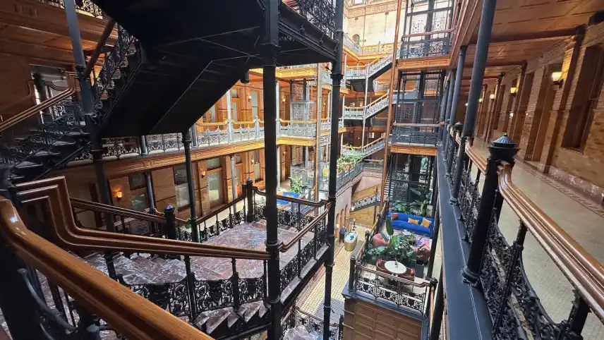 A stair hall lit from above inside an older city building